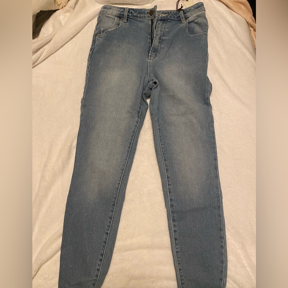 Rollas light wash straight leg jeans. New with tags